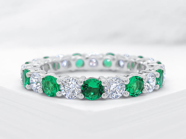 Four Claw Diamond and Emerald Eternity Ring - Ian Sharp Jewellery
